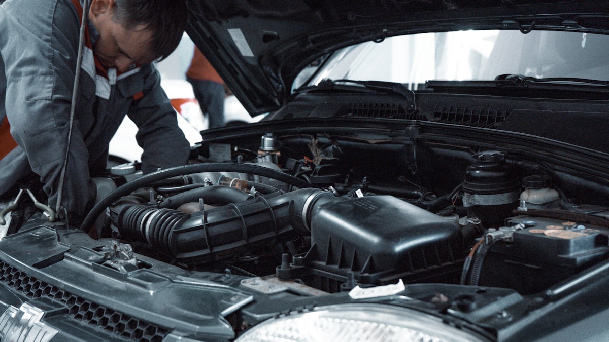 Vehicle being serviced on a lift in an auto repair workshop